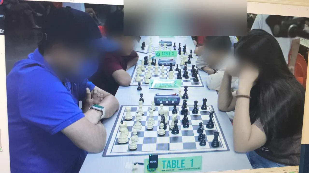 Table 1 at the Keong Hoe tournament in Penang, seen through the tournament camera, faces blurred