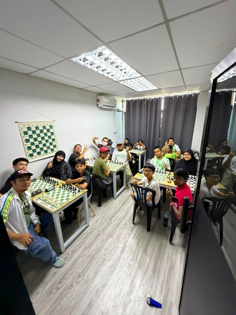 Local chess club community gathered around OTB boards